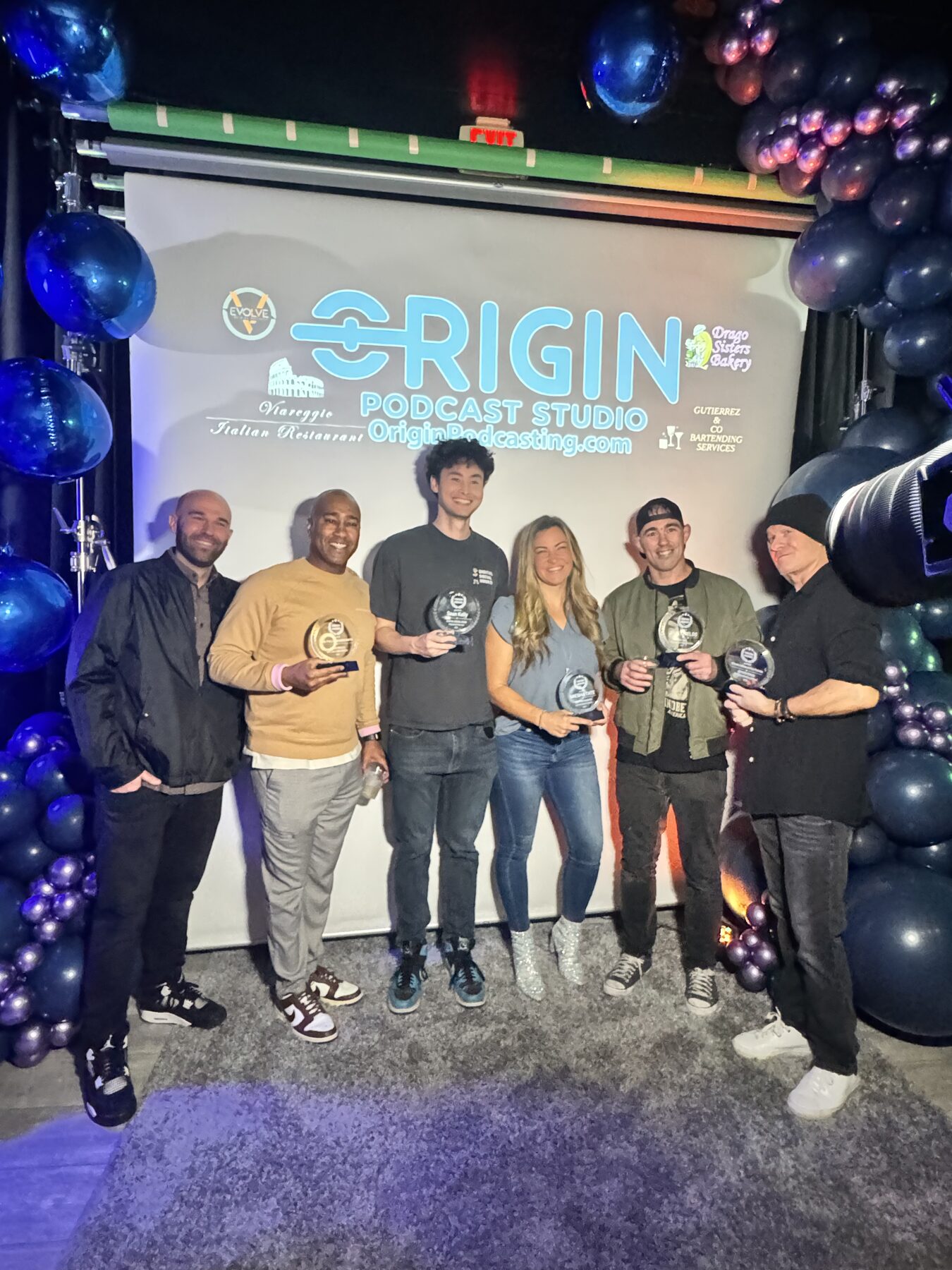 Paki Phillips with fellow honorees at a podcast awards event