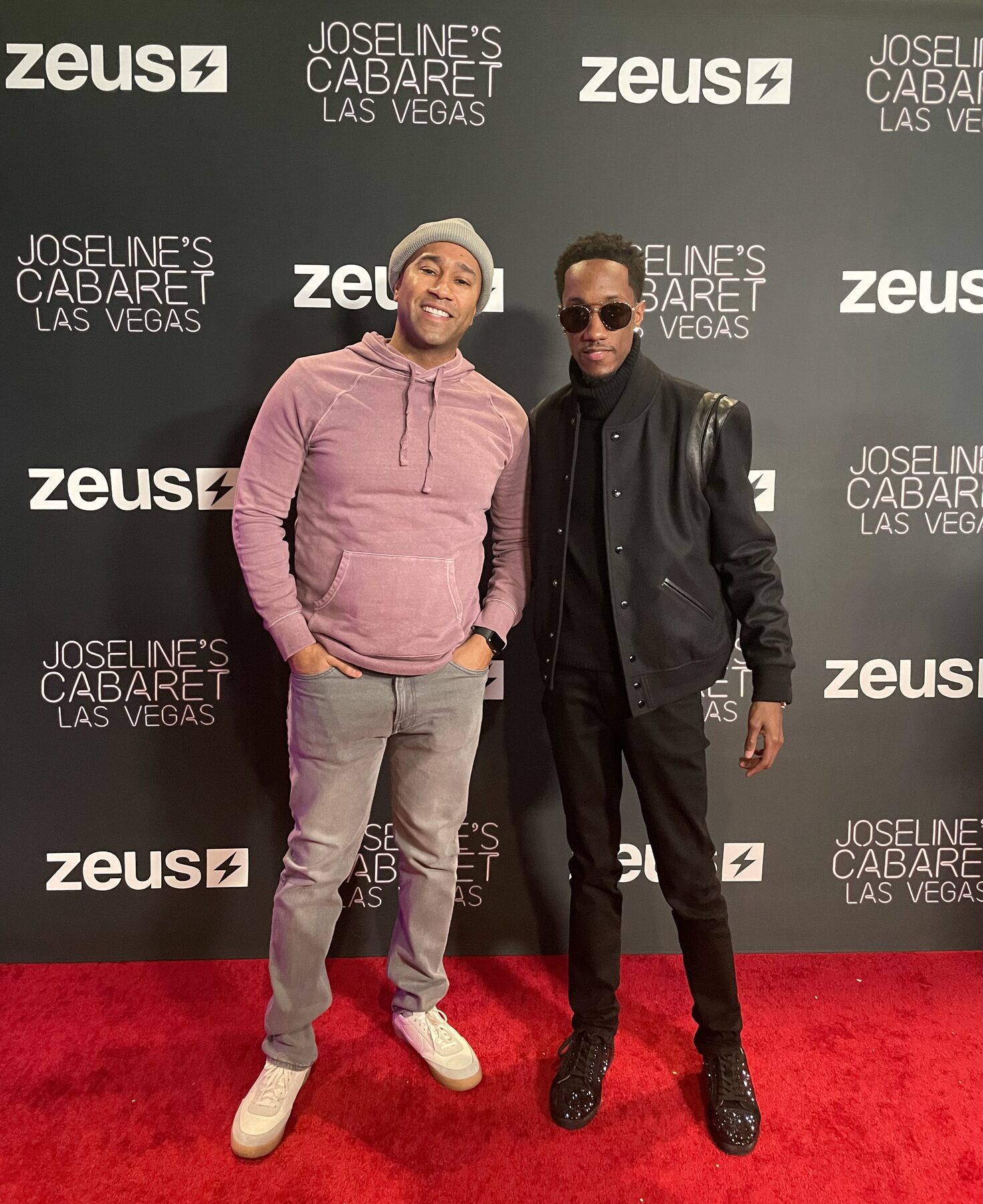 Paki Phillips with a guest on a red carpet