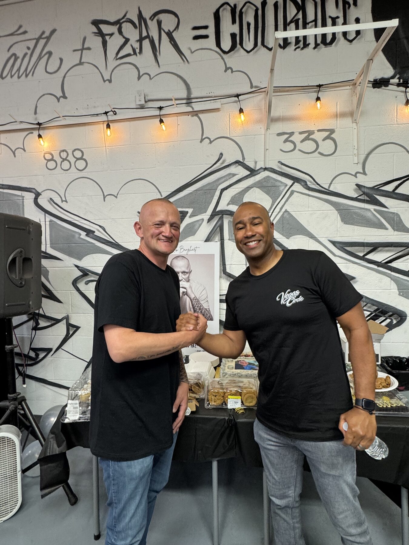 Paki Phillips shaking hands with a guest