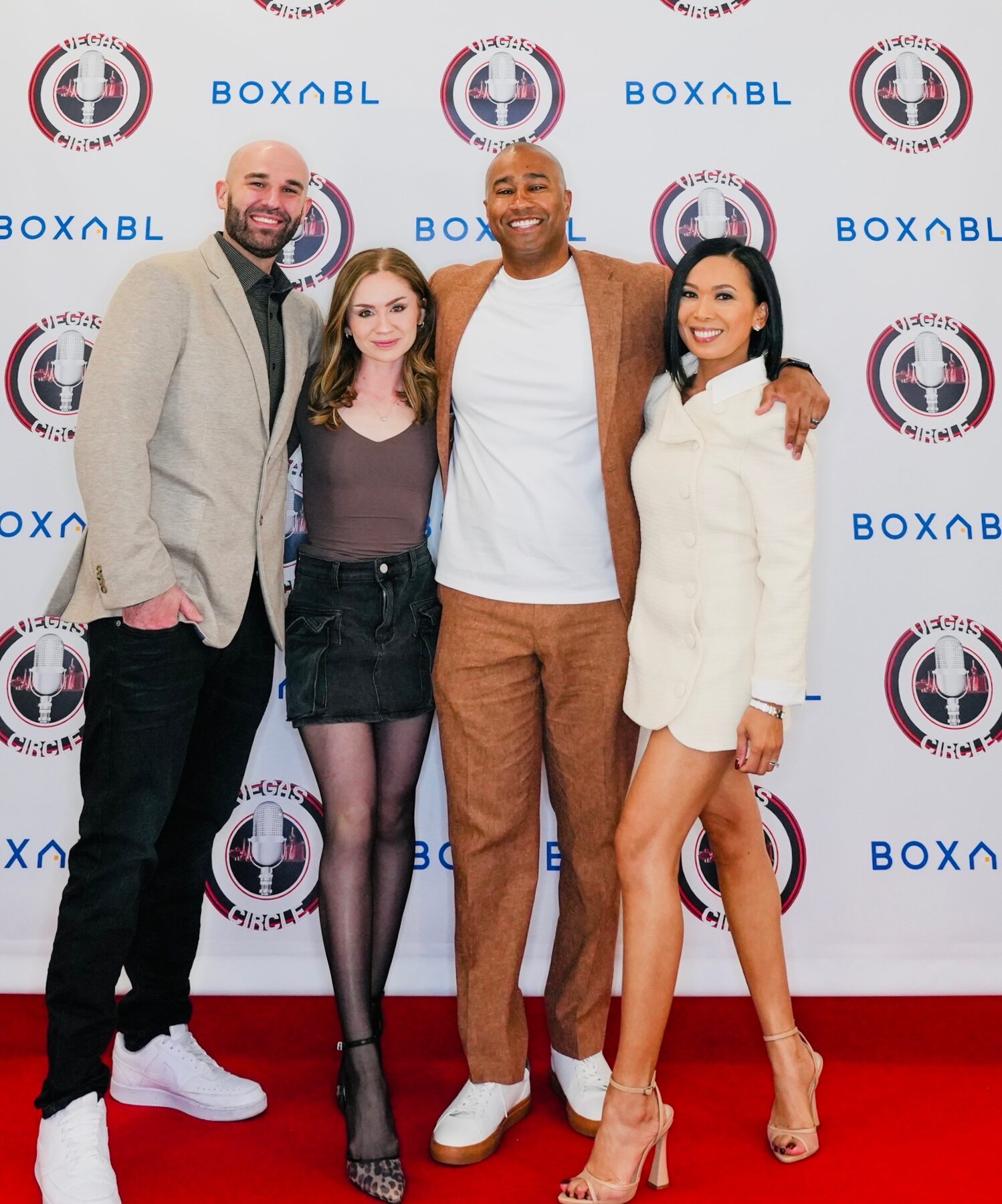 Paki Phillips with guests on a red carpet