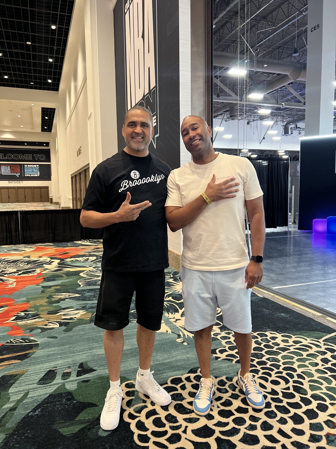 Paki Phillips with a guest at a convention hall