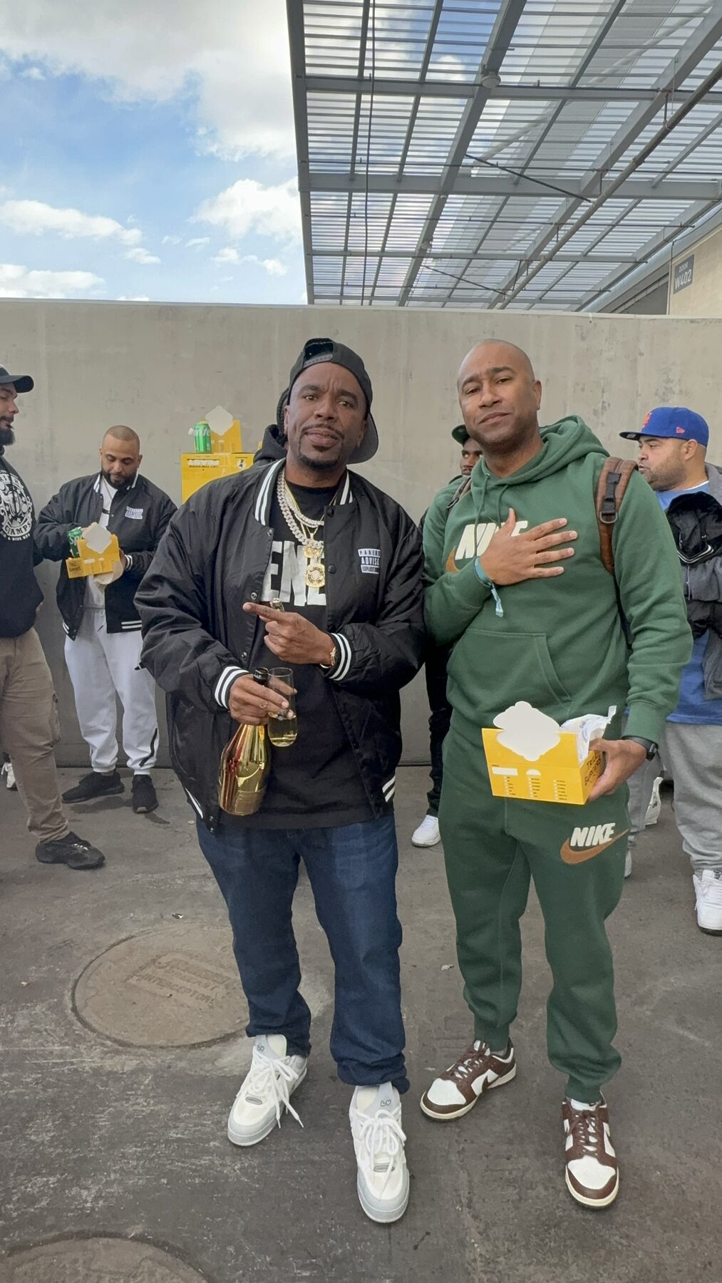 Paki Phillips with a guest at an outdoor event