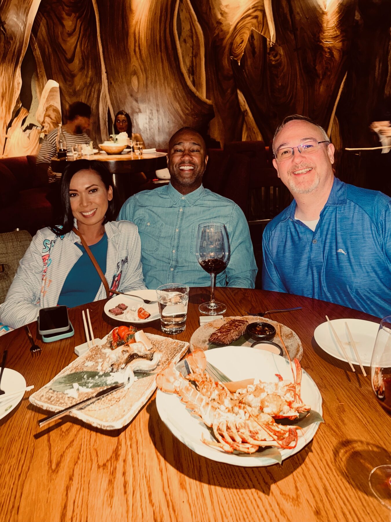 Paki Phillips with guests at a dinner table