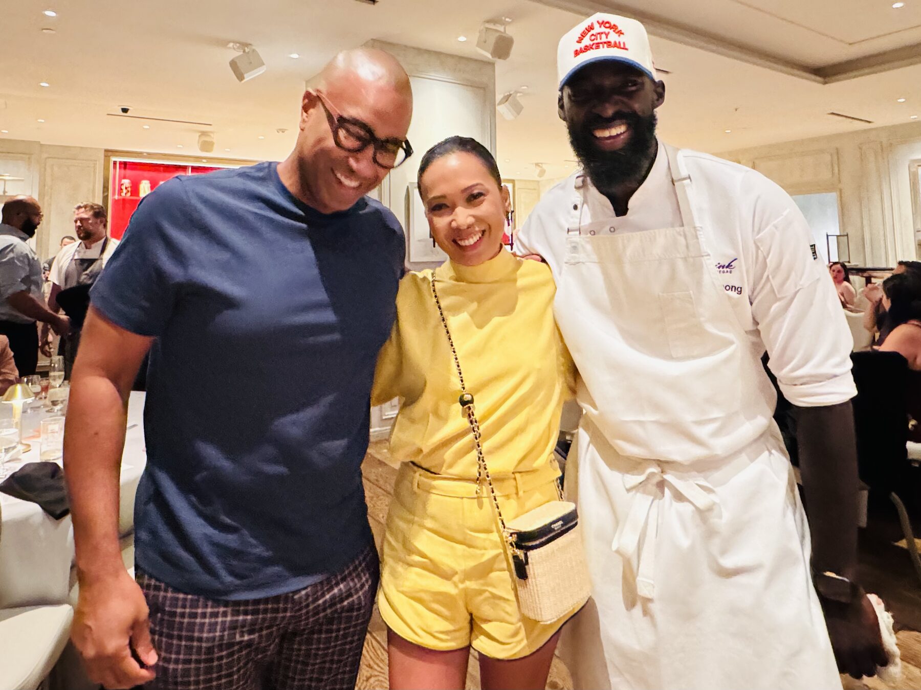 Paki Phillips with friends and a chef at a dinner