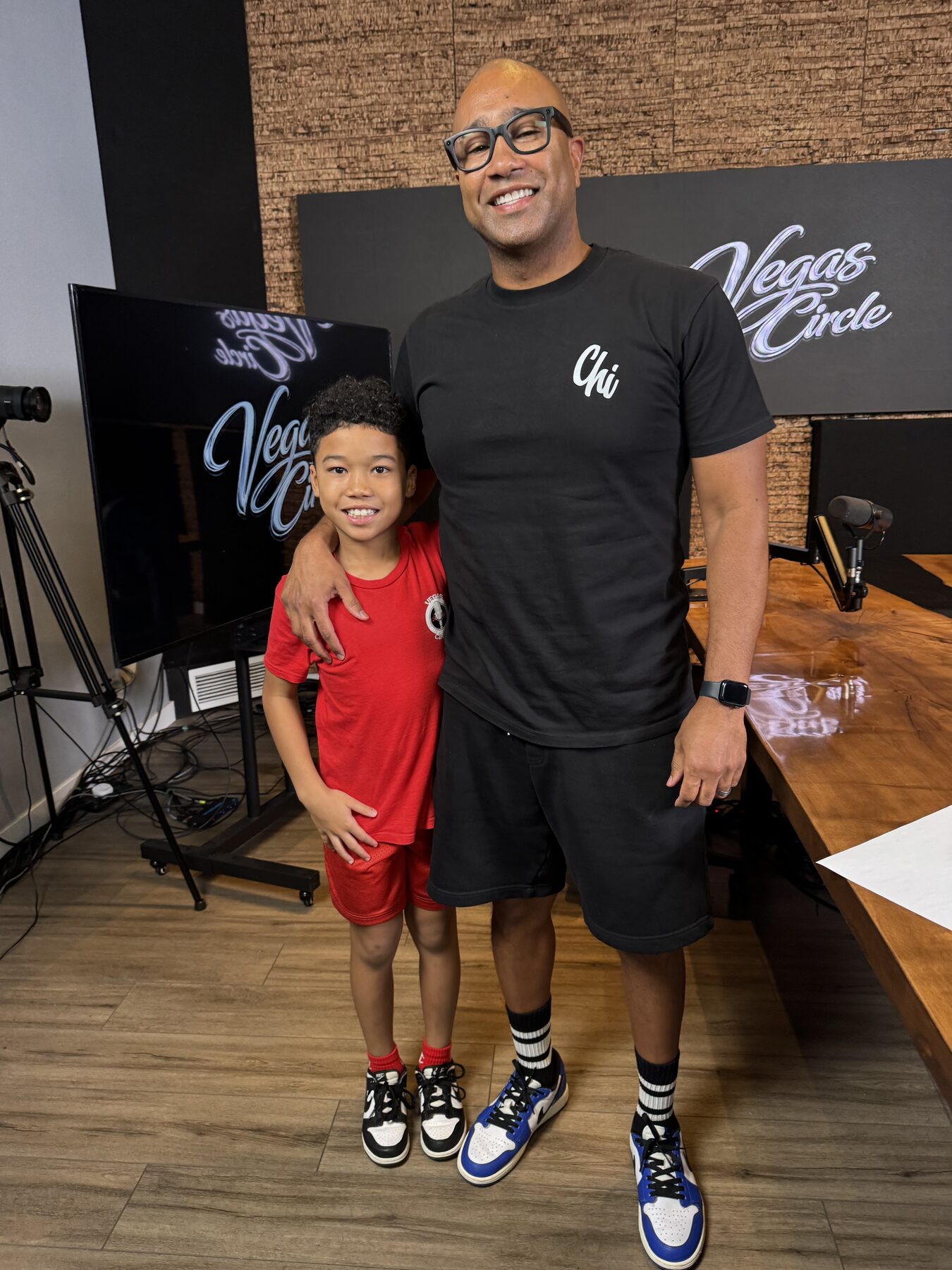Paki Phillips with a young co-host in the studio